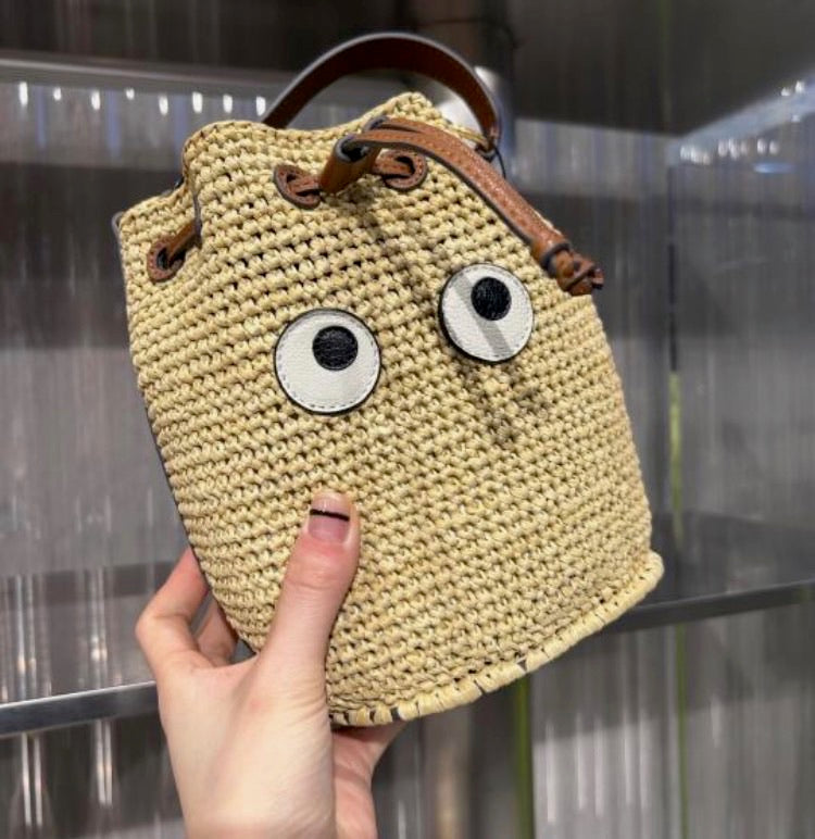 Anya Hindmarch Raffia Eyes Drawstring 大眼睛草編水桶包/425L262 ㊙️折扣🉐11000💰